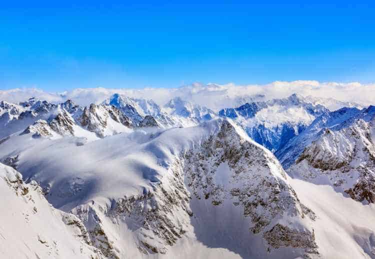 Eternal beautiful snowy mountain tops and blue infinite skies