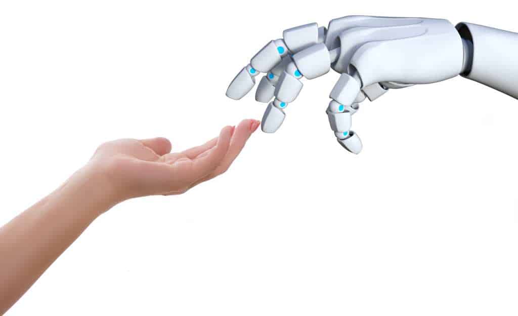 Robotic hand touching a human hand showing proximity to man-machine convergence