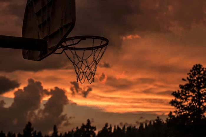 An old basketball basket that Michael Jordan used to train with at sunset 
