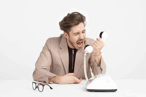 Pushy salesman shouting on the phone trying to sell to a client