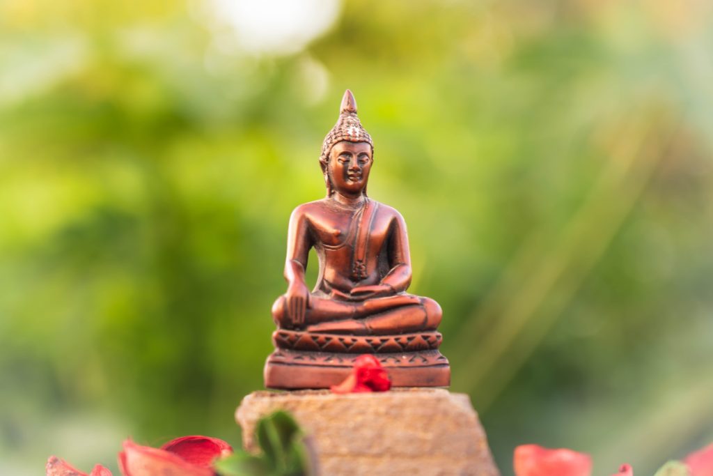 tiny spiritual Buddha statue