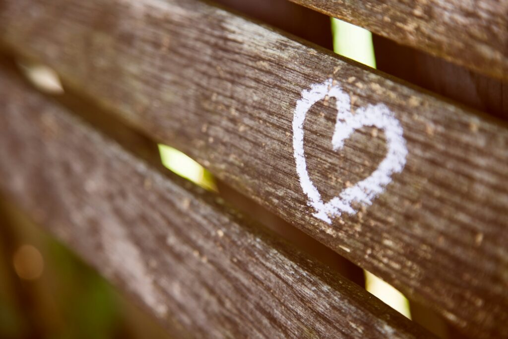 A beautiful heart painted on a wood bench and a great Sarah Dessen quote about love - 50 Best Love of My Life Quotes