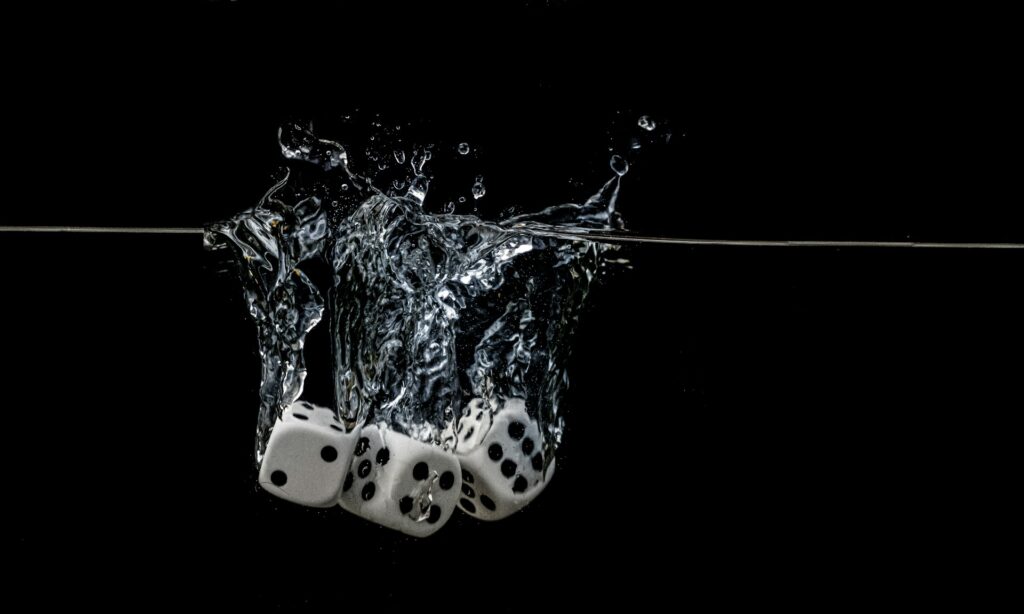 Dramatic destiny dice hitting water